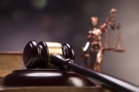 67bf548eba741_index 40 A judge 's gavel and statue of justice in the background.