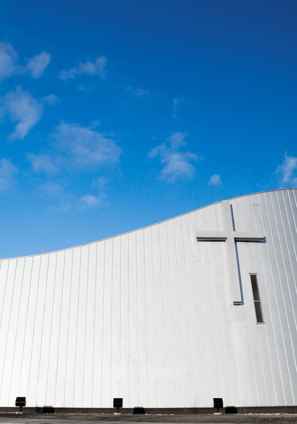 Modern Church A white church with a cross on the side of it.